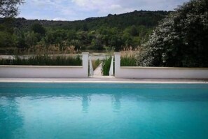 The pool looking out over the jetty and lake
