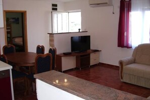 Spacious living room with large sofa bed