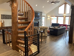 Beautifully hand-crafted spiral staircase leads you up to the cozy loft. 