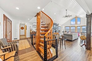 Beautifully hand crafted spiral staircase leads you up to the cozy loft