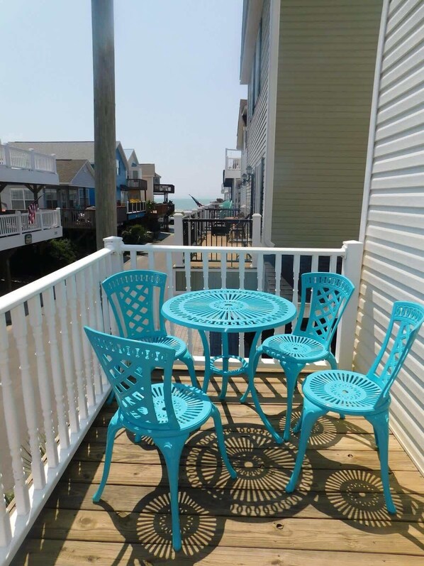 Small table on front porch outside kitchen