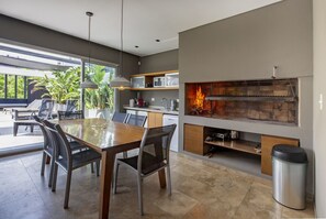 Rooftop grill and kitchen.  The doors lead to the rooftop patio and plunge pool.