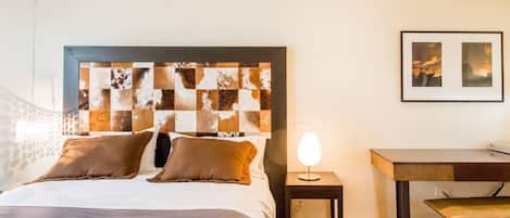 Well appointed bedrooms with desk, ensuite bathroom, comfortable mattress, TV, high quality linens and blackout blinds