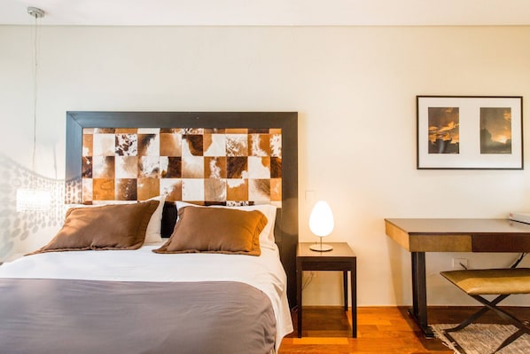 Well appointed bedrooms with desk, ensuite bathroom, comfortable mattress, TV, high quality linens and blackout blinds