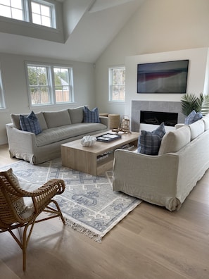 Great room with fireplace and TV
