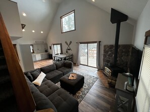 Double glass patio doors brings in all the views of the wooded lakeside yard. 