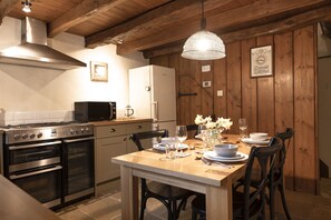 Ground floor: The kitchen has an electric range oven with gas hob