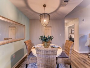 Enjoy catching up on the day's adventures over your favorite meal at the charming dining table which offers seating for 4.