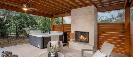Beautiful outdoor fireplace + hot tub.