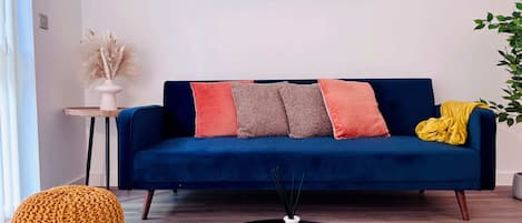 Cuddle up on this lush velvet sofa