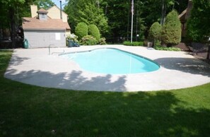 Shared association pool w/ bathroom, tables, chairs and loungers