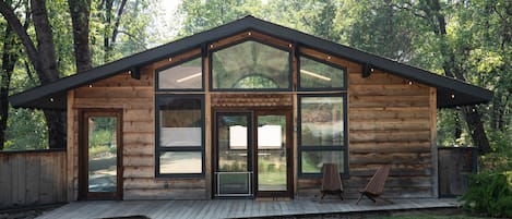 Cedar-sided detached studio with vaulted ceiling and floor to ceiling windows!