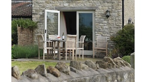 The Barn terrace with garden seating, soak up the wonderful views