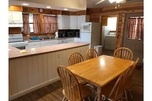 Kitchen with dish soap, dishwasher soap, fire extinguisher, & fire blanket.