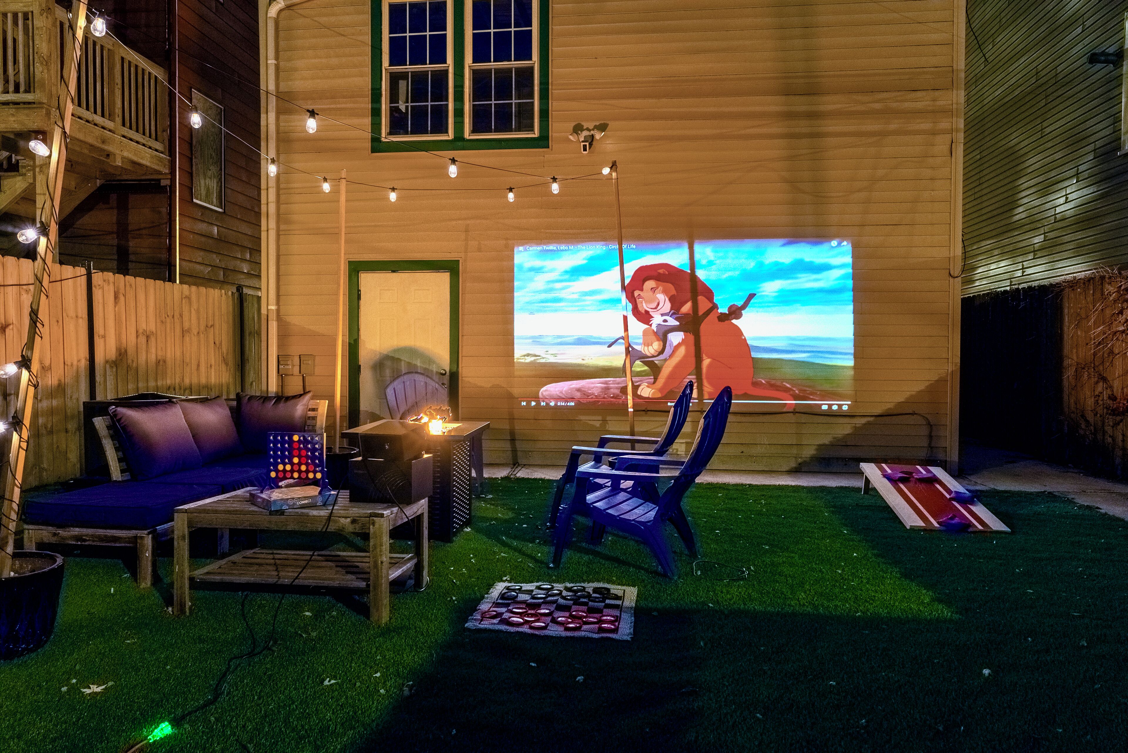 Fenced in backyard; turf, charcoal grill, yard games, movie projector, & more.