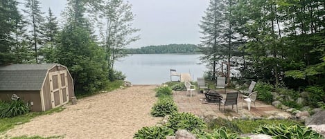 Private beach, dock and shed with kayaks.