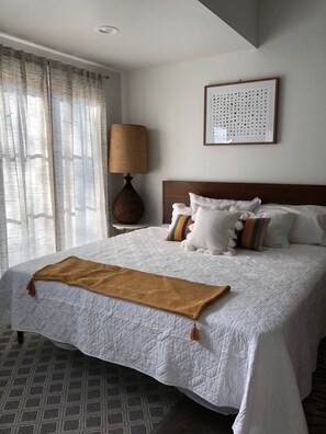 Master Bedroom with tons of natural light, Rear entrance to back yard & driveway