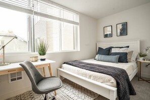 2nd floor bedroom with queen bed and work desk