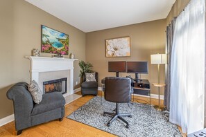 Dedicated Workspace with Two Tisdale Dark Grey Fabric Armless Chairs