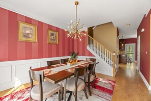 Dining area where meals come alive with vibrant colors and inviting ambience.