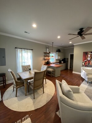 Kitchenette and dining table with two barstools at peninsula island.