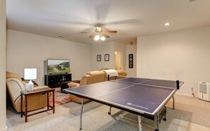 Recreational retreat with ping-pong fun and cozy lounging area.