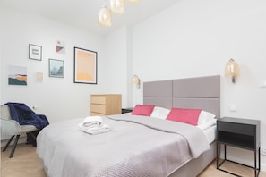 The bedroom's modern design ensures a comfortable stay.