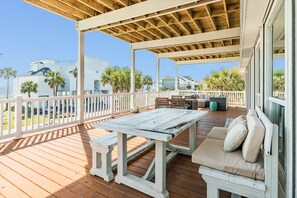 Unwind after a day at the beach on the large covered deck