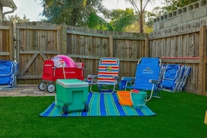 Beach umbrella, chairs, rolling cart, rolling cooler, and towels provided