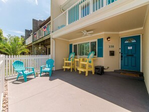 Front patio with balcony Adirondack chairs