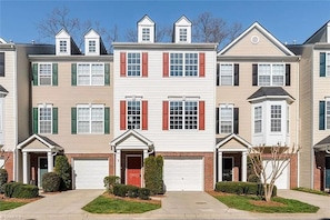 Front of townhome (red door and shutters).