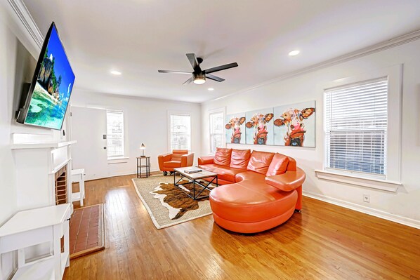 Living Room with 75" Roku TV. Front entrance on the left. 