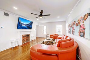 Living Room with 75" Roku TV. Front entrance on the left. 