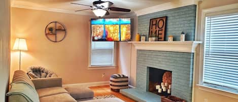 Enjoy this cozy family room with Roku TV
