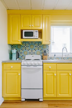 Cheerful Kitchen stocked with all the comforts of home