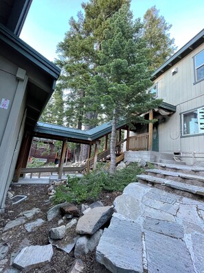 Summer entry flagstone stairway flows to flagstone patio and BBQ area