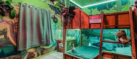 Experience the wild side in our Jungle Adventure Bedroom. With cozy bunk bed, this room offers a unique and exciting stay for children who love adventure.
