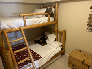One of a kind log bunk bed. Full on bottom, twin on top.  Kids on the top only.