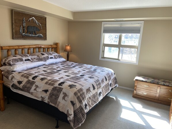 King log bed in master with TV. Black out blinds. New mattress. 