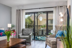 Living room with sliding glass doors to lanai patio