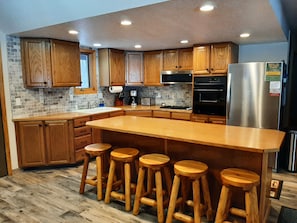 Kitchen with all the appliances and dishes you need to make any meal.