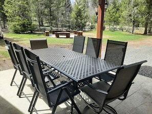 Patio set and fire pit in the background.