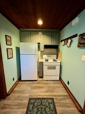 Kitchen is between back Bedroom area and front Twin bunk/ Living Room Area