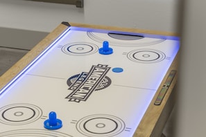 On those rainy days retreat to the game room in the garage with air hockey table and giant connect 4 wall game.