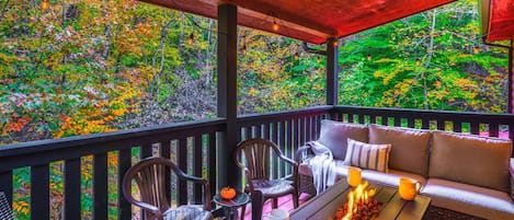 Enjoy the changing colors on the back balcony with fire table and plenty of seating