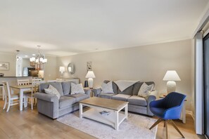 Living room with TV and patio access
