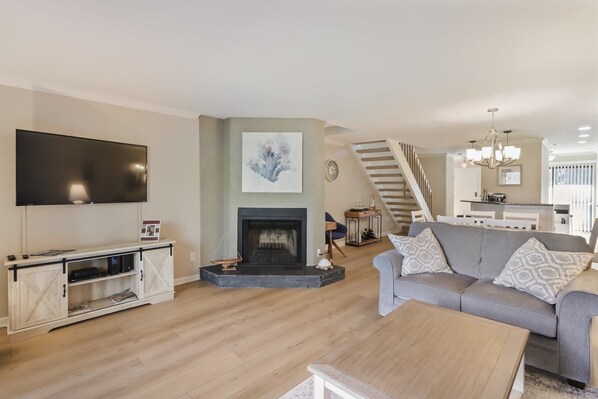Living room with TV and patio access