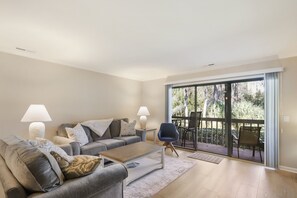 Living room with TV and patio access