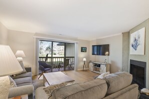Living room with TV and patio access
