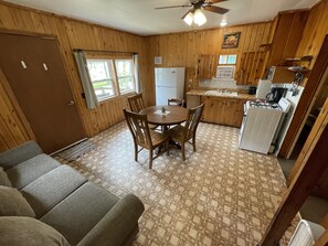 Cabin 3's combined kitchen/dining/living area